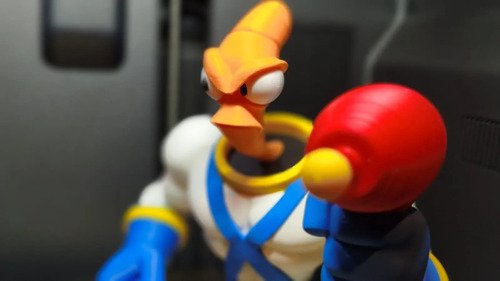 D_618625-MLB111765670112_062026-O.jpg Earthworm Jim 24cm + Base Action Figure Colecionável Geek - Imagem 4